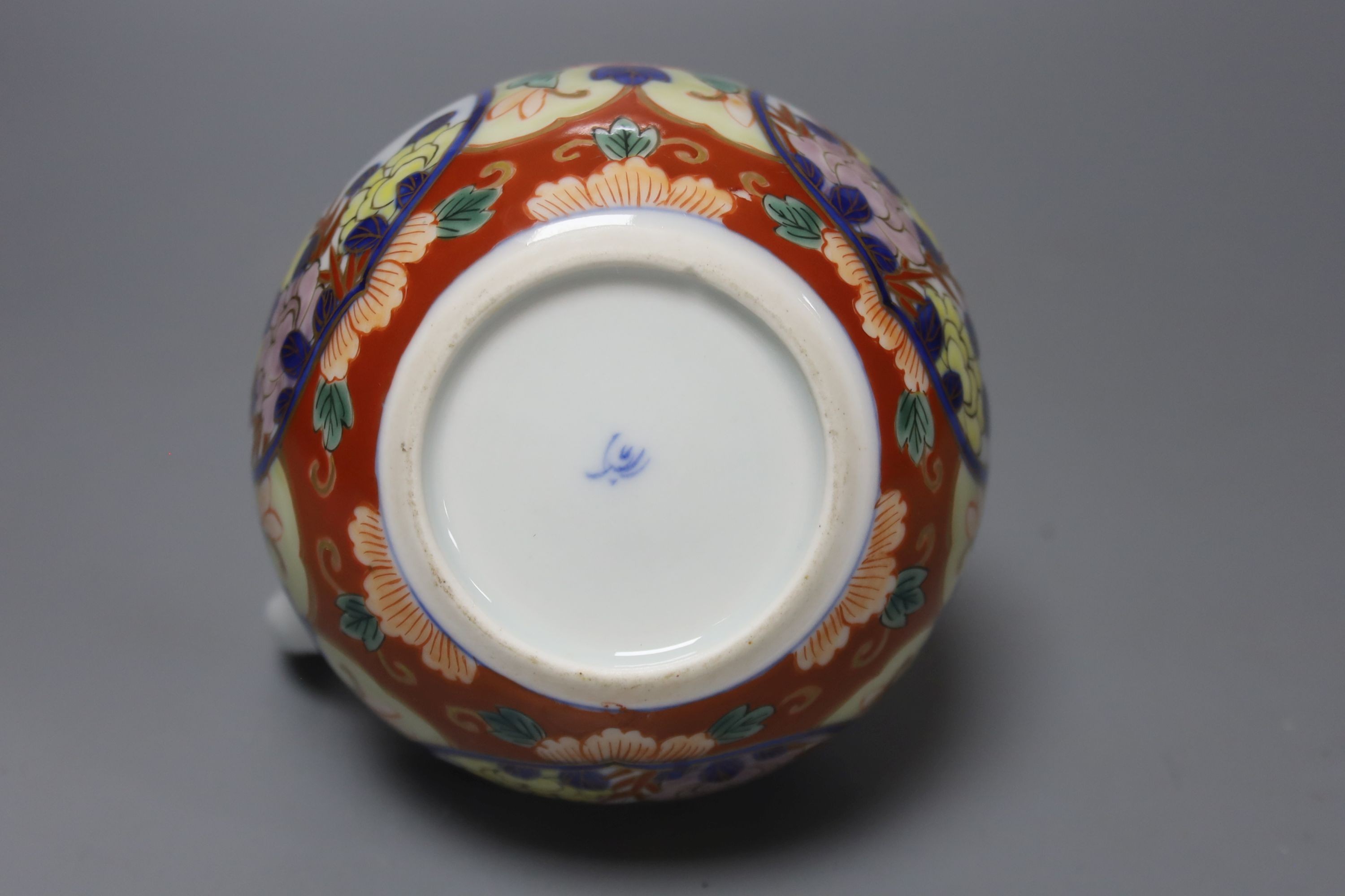 A Satsuma yellow ground vase, a Kutani twin handled cup and cover, a Fukugawa Imari jug and an Imari koro and cover 27cm, three wood stands